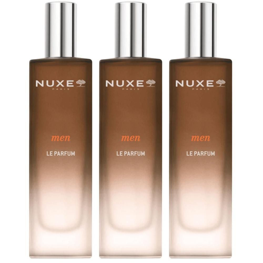 Drie Nuxe Men Le Parfum flacons met zilveren dopjes en bruine kleurverloop.