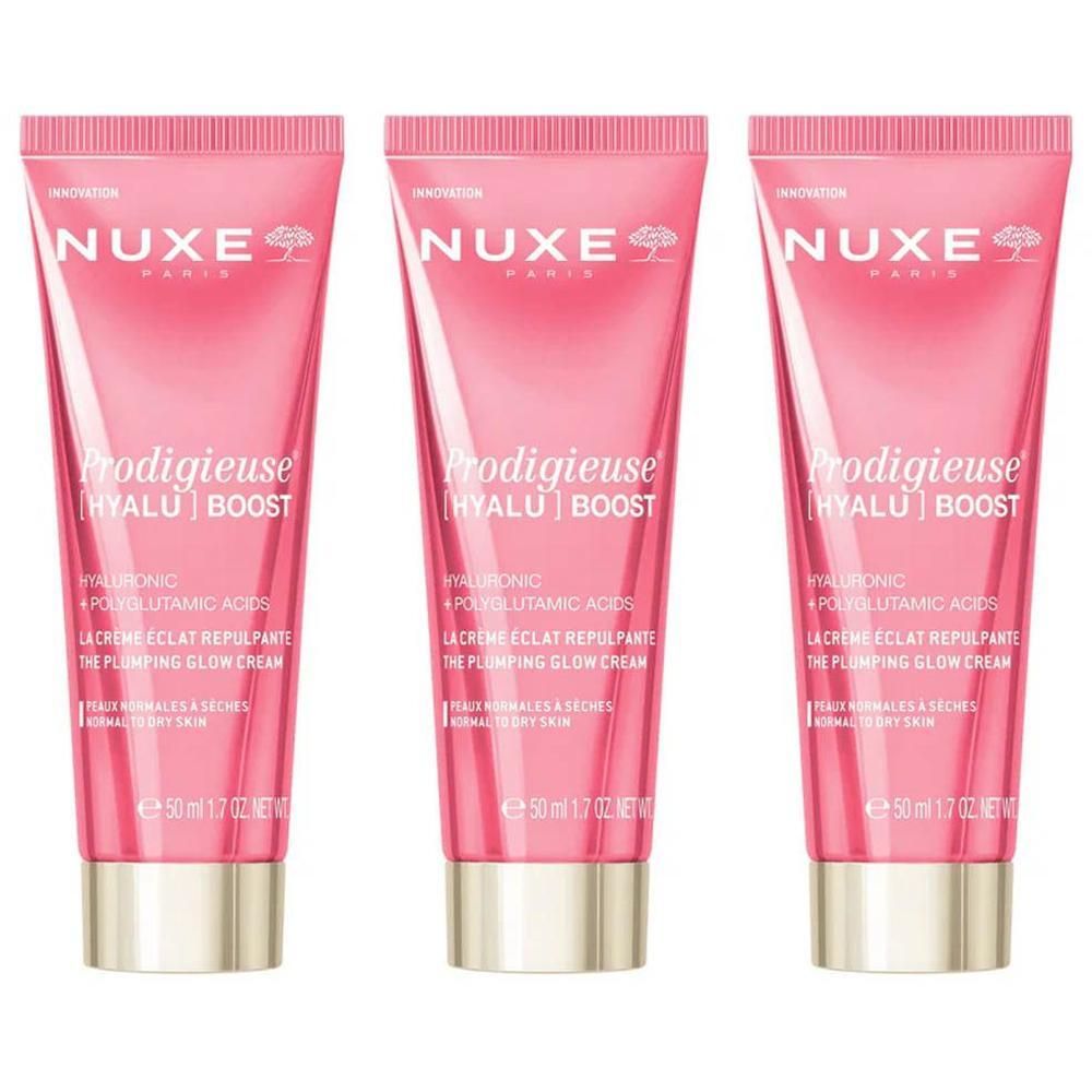 Drie Nuxe Prodigieuse Hyalu Boost crèmetubes, roze met opdruk en gouden dop.