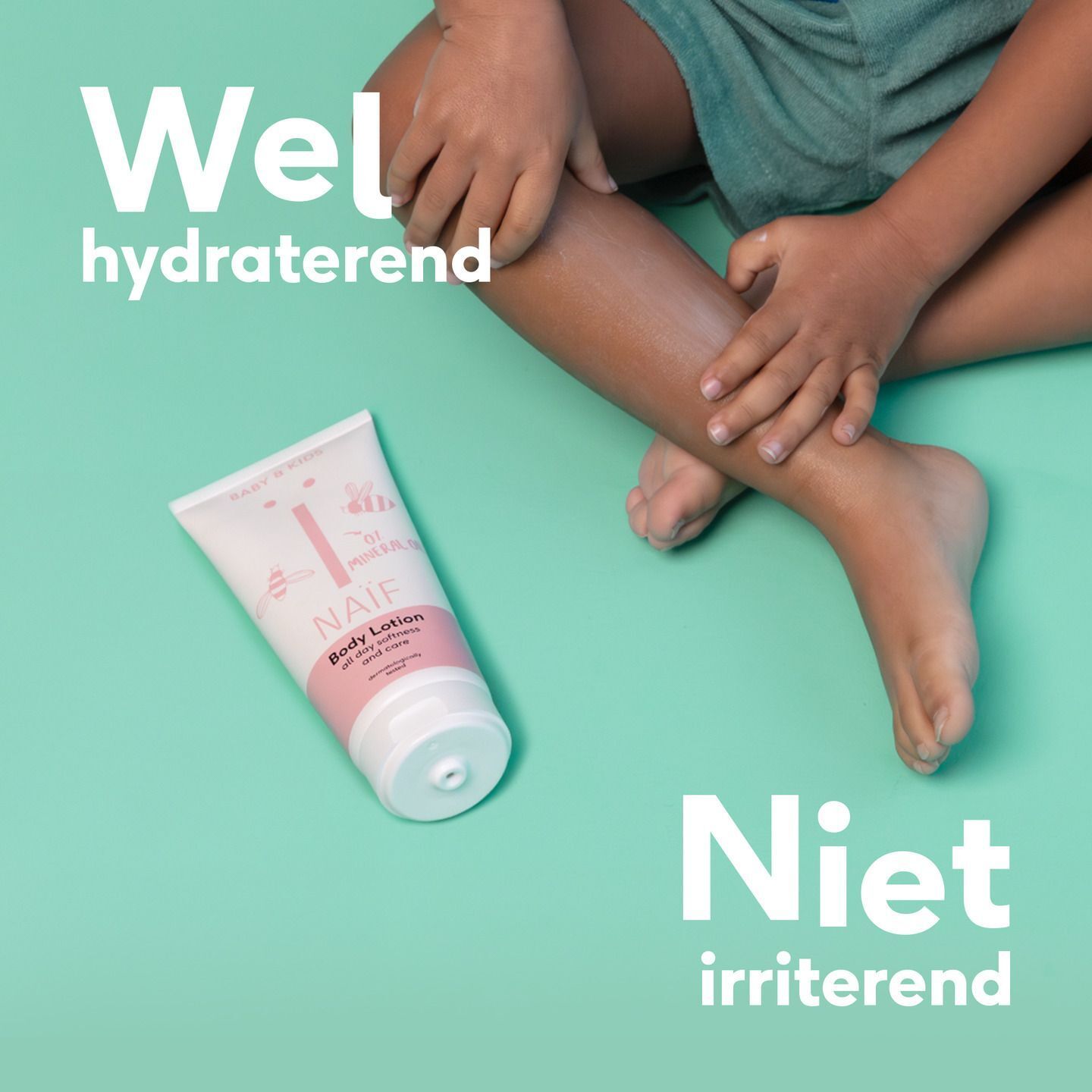 Een Naïf Body Lotion tube met de tekst 'Mild voor de gevoelige huid'.