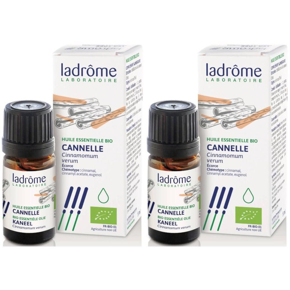 Twee flesjes Ladrôme biologische kaneelolie met verpakking. Het etiket toont kaneelstokjes en een biologisch keurmerk.