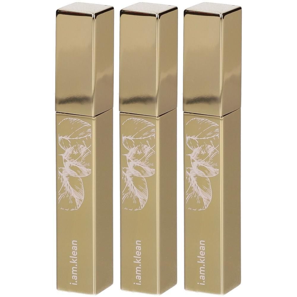 Drie gouden flesjes met bladerenpatroon en "i.am.klean" opschrift.