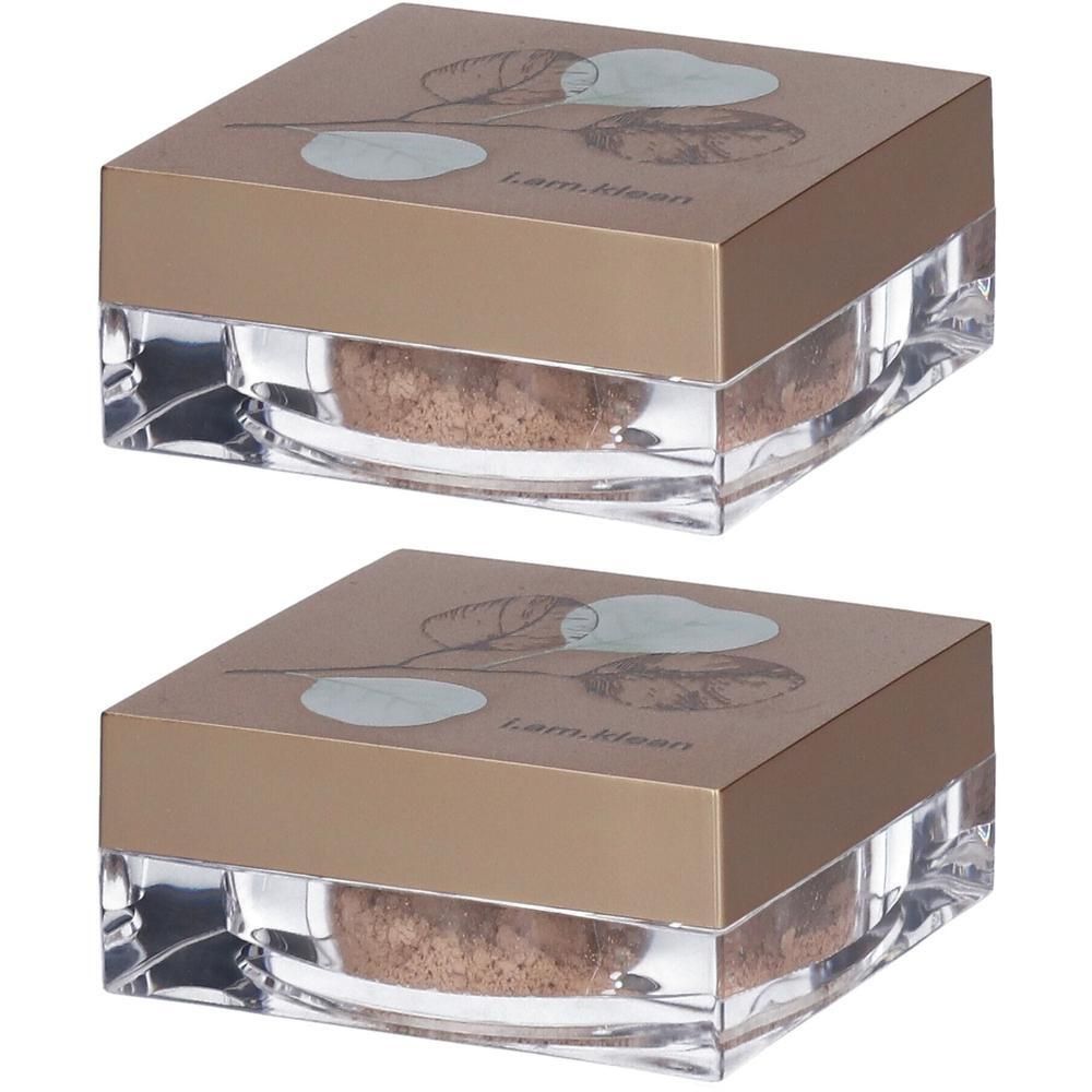 Deux contenants carrés de poudre minérale. Couvercle doré avec motif de feuille et logo de la marque.