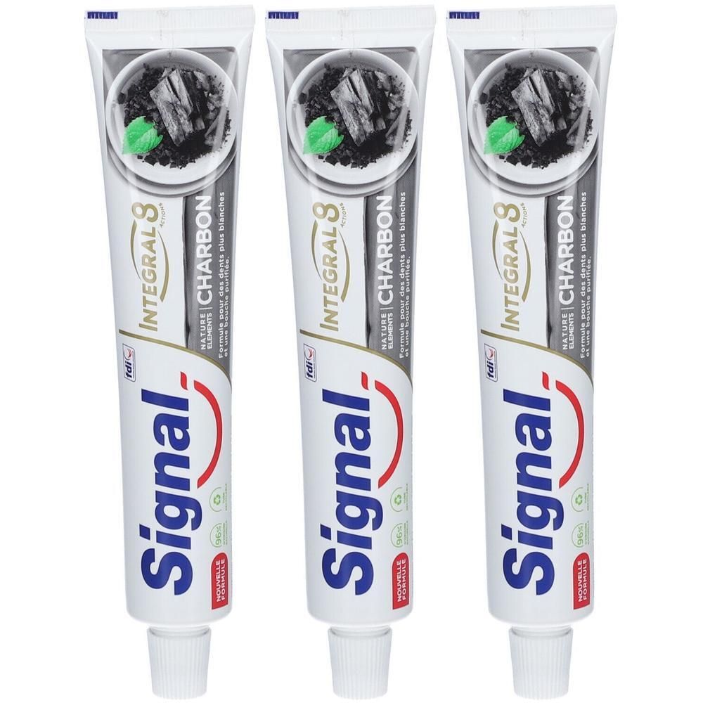 Drie tubes Signal Integral 8 tandpasta met actieve kool. De voorkant toont houtskoolbrokken en groene blaadjes.
