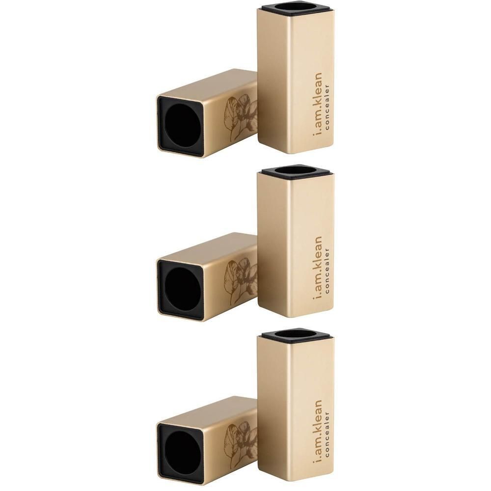 Récipients rectangulaires dorés avec capuchon noir. Texte : i.am.klean concealer.