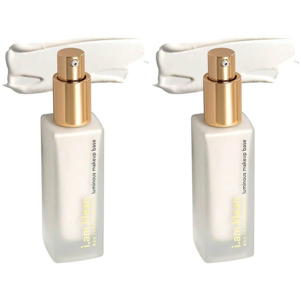 Deux flacons de i.am.klean Luminous Base Primer avec pompes dorées et traînée de produit blanc.