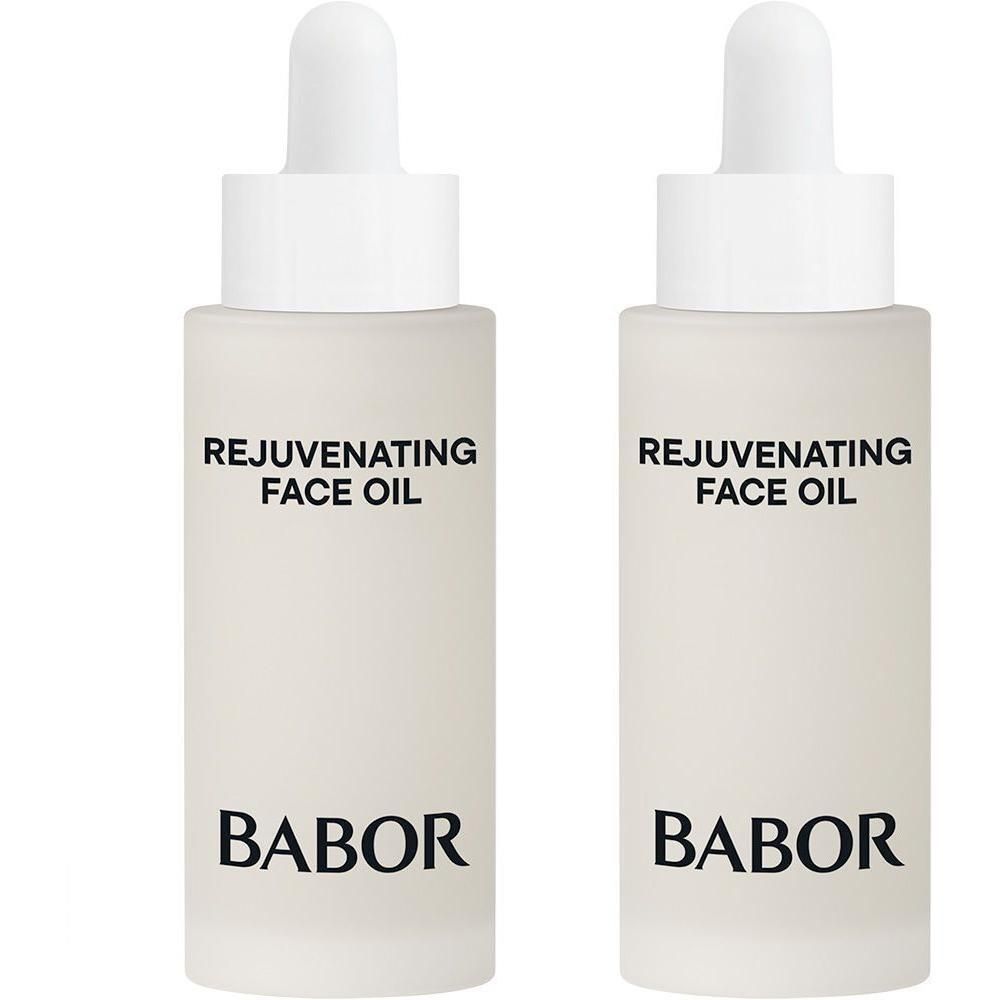 Twee glazen flesjes met druppeldop, gevuld met gezichtsolie. Opschrift: BABOR REJUVENATING FACE OIL.
