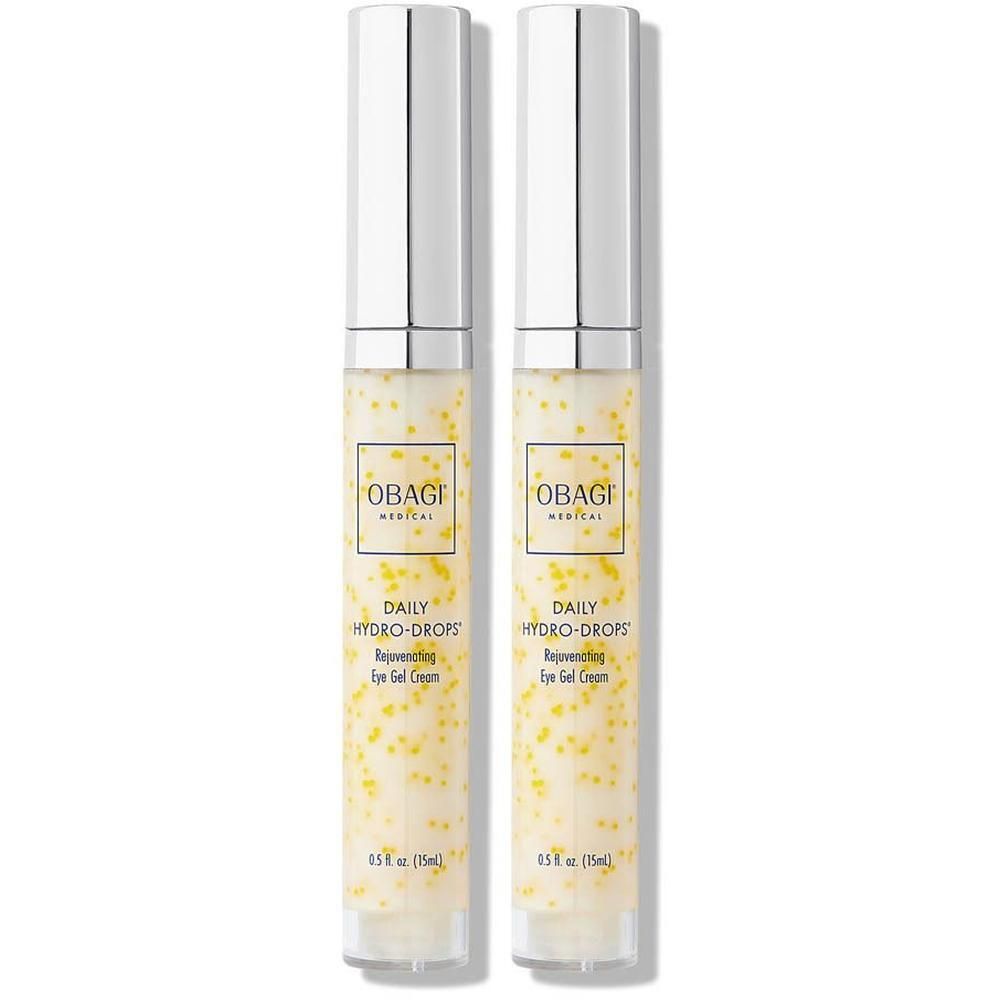 Deux flacons Obagi Daily Hydro-Drops Rejuvenating Eye Gel Cream avec capuchons argentés et perles jaunes dans la crème.
