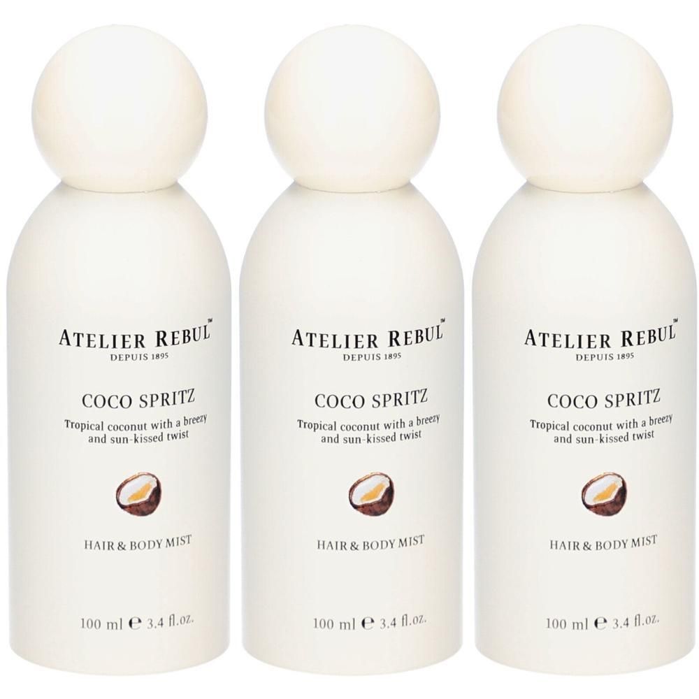 Drie witte flessen Atelier Rebul Coco Spritz Hair & Body Mist, elk 100 ml.