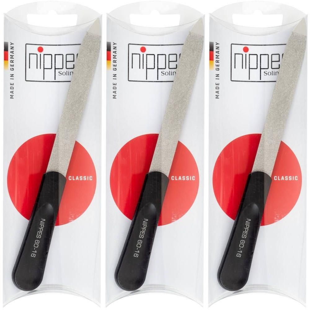 Drie nagelvijlen met zwarte handgreep en zilveren vijloppervlak, verpakt in een doorzichtige hoes. "Made in Germany" en "Nippes" zichtbaar.