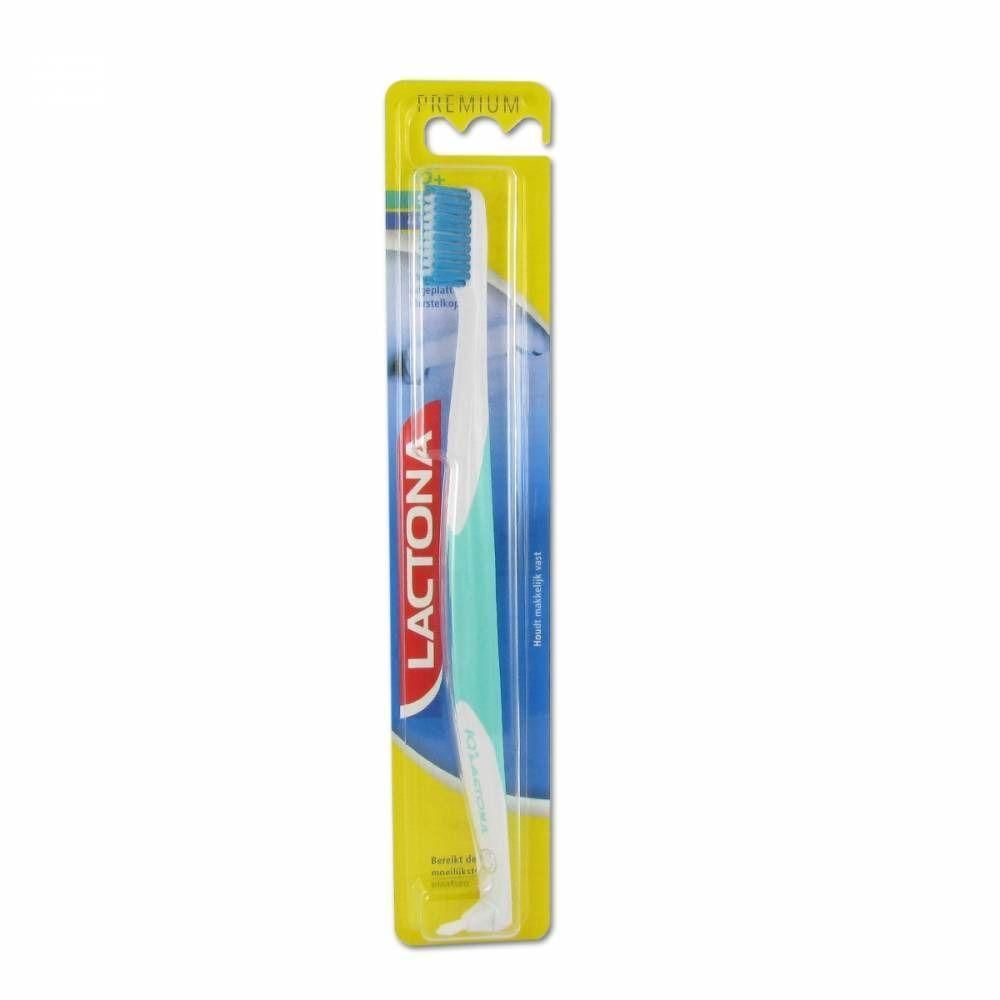 Brosse à dents Lactona Iq+ Soft en blister, tête bleue et manche blanc-menthe.
