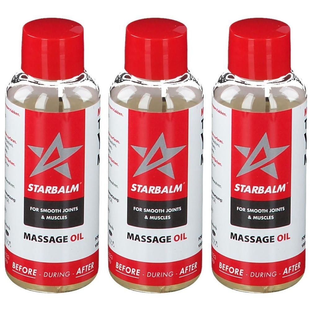 Drie flessen Star Balm massageolie met rode doppen. Heldere vloeistof in transparante flessen met rode en witte etiketten.