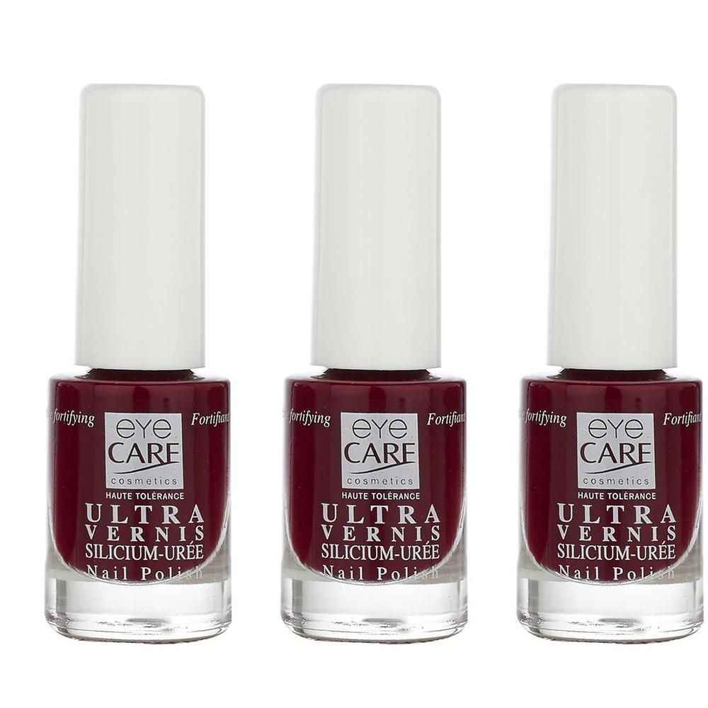 Trois flacons de vernis à ongles Eye Care Ultra Vernis Silicium-Uree, couleur bordeaux.