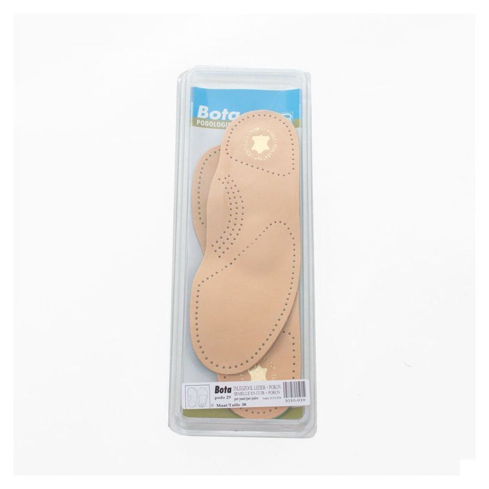 Une paire de semelles intérieures en cuir dans un emballage blister.
