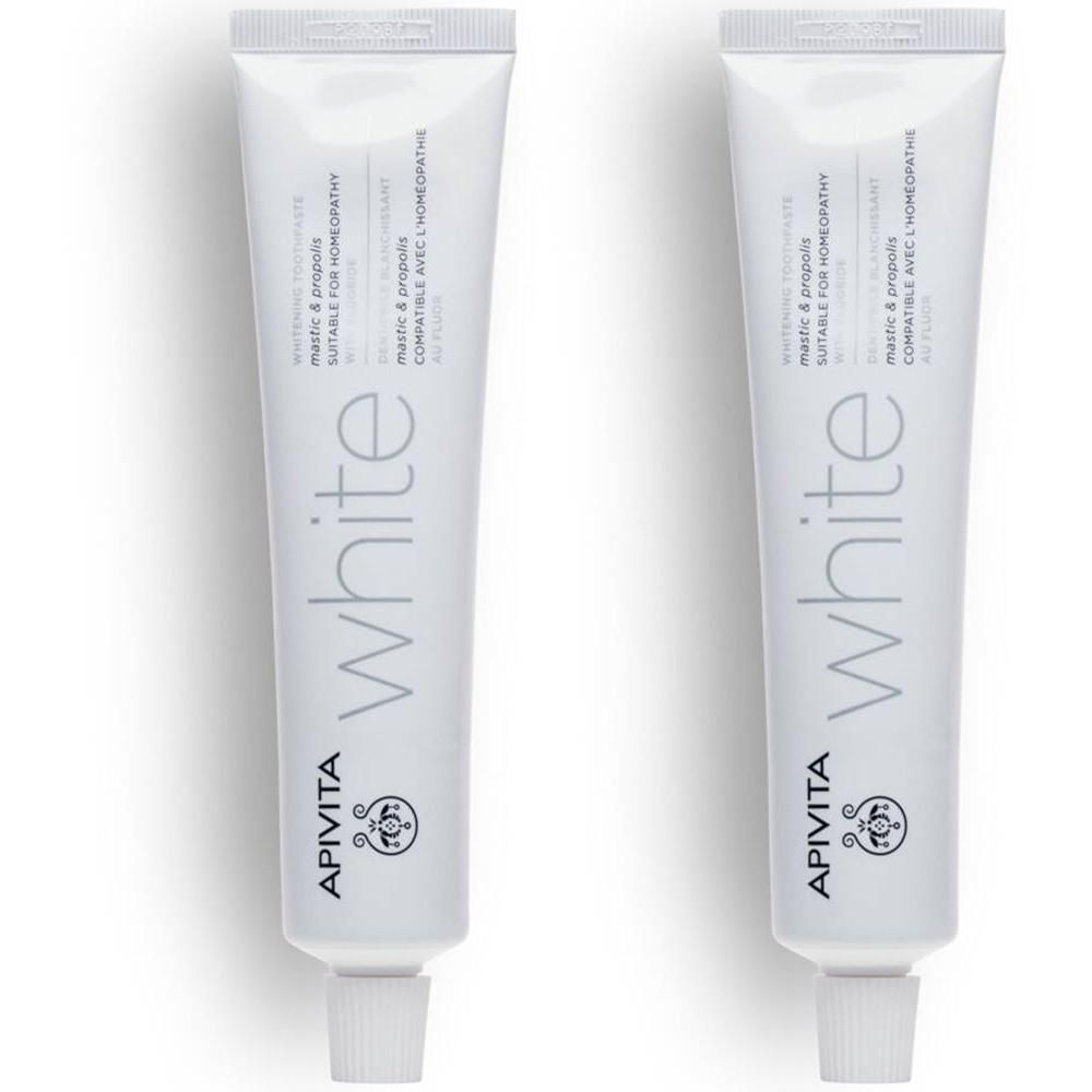 Deux tubes de dentifrice blancs "white" et "APIVITA".