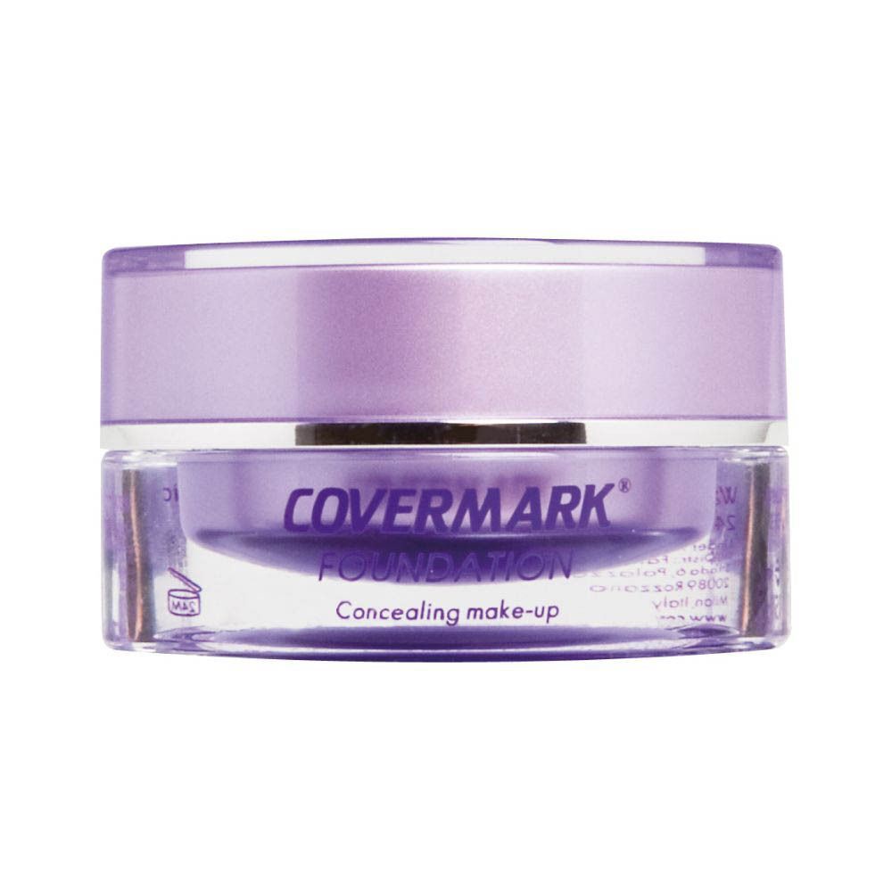 Un pot de fond de teint Covermark avec couvercle violet et contenu visible.