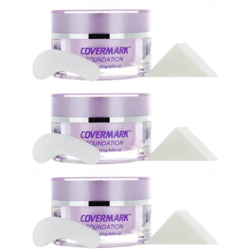 Trois pots de Covermark Foundation, chacun avec une spatule et deux éponges de maquillage.