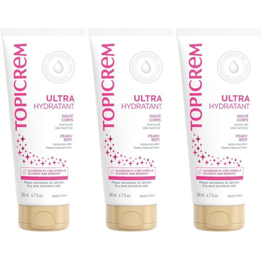 Trois tubes de Lait Corporel Ultra Hydratant Nacré Topicrem avec bouchons dorés.