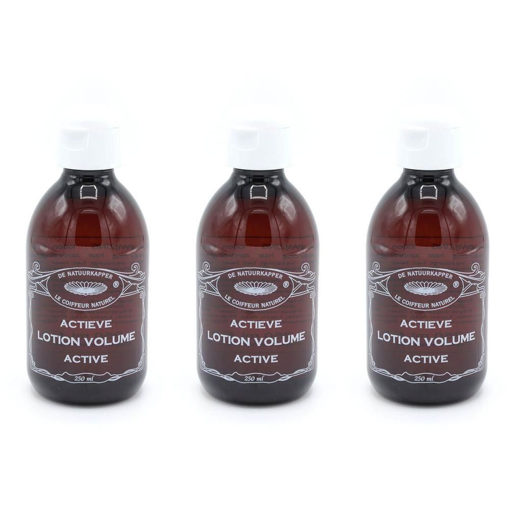 Trois bouteilles Le Coiffeur Naturel Lotion Volume Active en verre brun avec bouchon blanc.