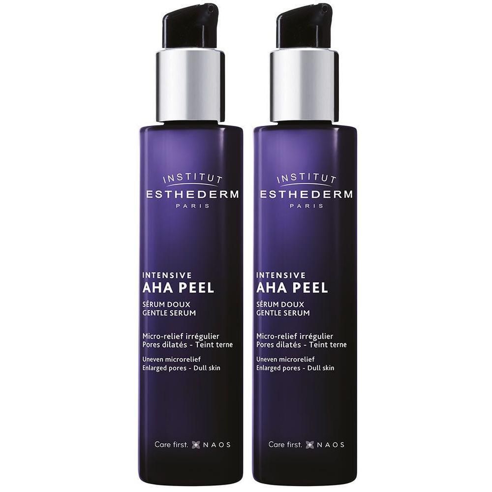 Deux flacons Institut Esthederm Intensive AHA Peel Sérum Doux avec pompes. Flacons violet foncé avec accents argentés.