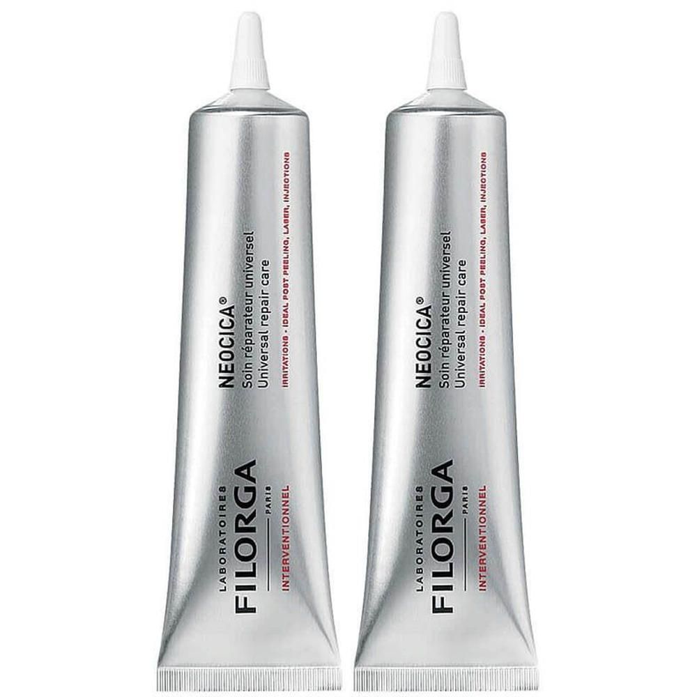 Twee zilverkleurige tubes Filorga NEOCICA Universal Repair Care met witte doppen.