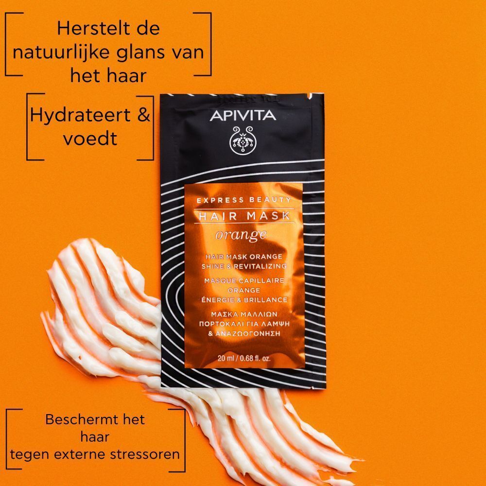 Sachet Apivita Express Beauty Orange haarmasker met sinaasappelschijf.