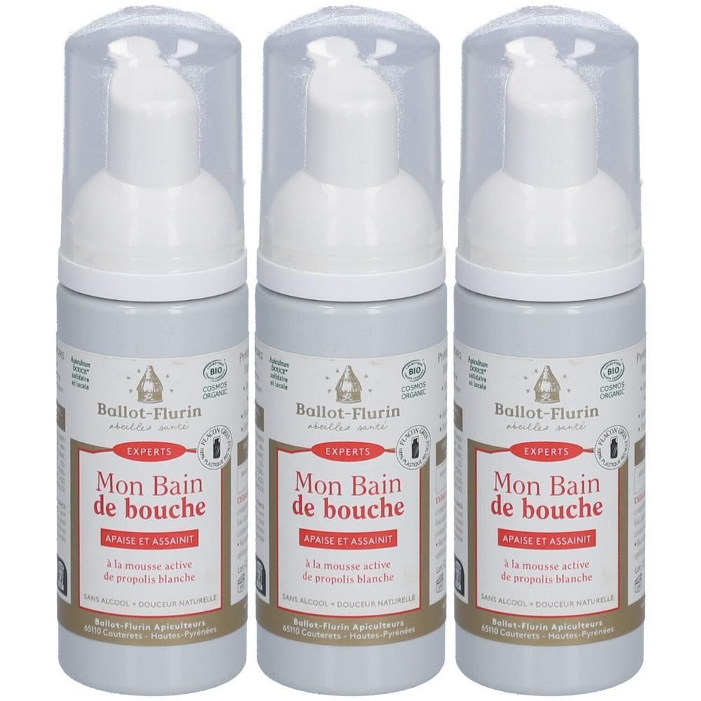 Trois flacons pompe de bain de bouche. Bouteilles blanches avec capuchons et distributeurs transparents.