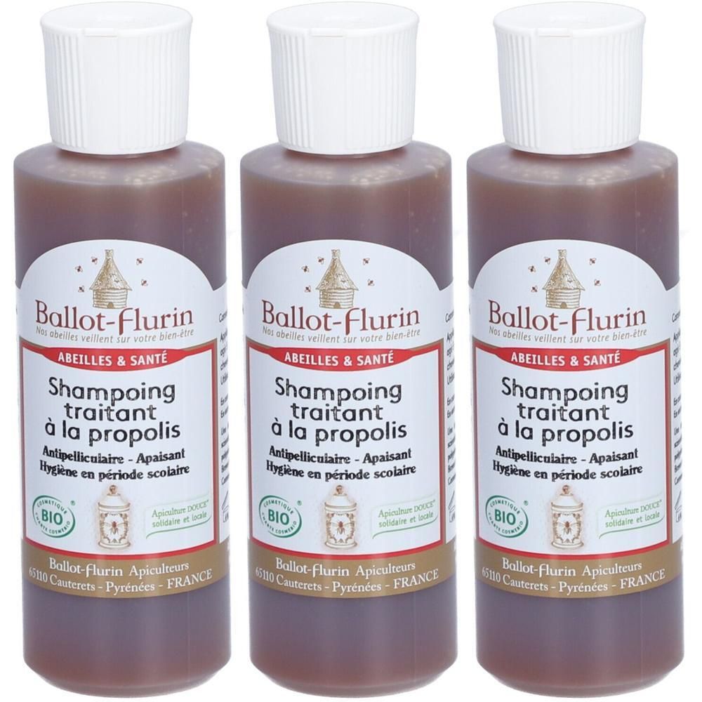Trois flacons de shampoing traitant à la propolis Ballot-Flurin. Bouchon blanc, liquide brun. Étiquette avec logo ruche et texte.