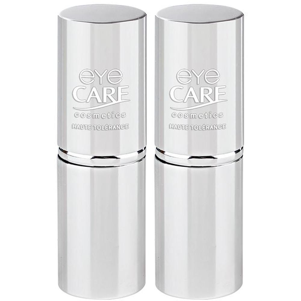 Deux contenants argentés cylindriques avec inscription "eye CARE cosmetics HAUTE TOLÉRANCE".