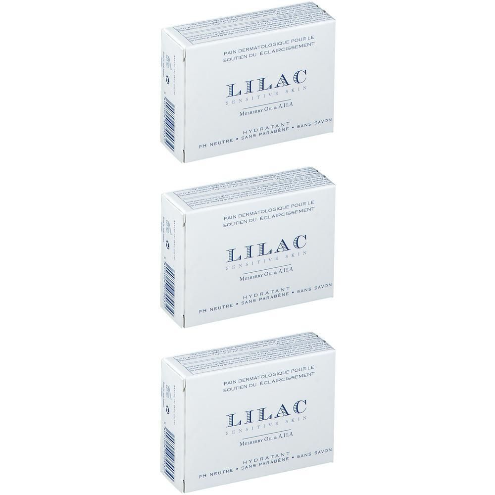 Drie pakken Lilac Pain Dermatologique Éclaircissant zeep, wit met paarse belettering.