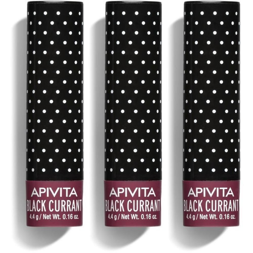 Trois sticks baume à lèvres au design noir à pois blancs. Mention Cassis.