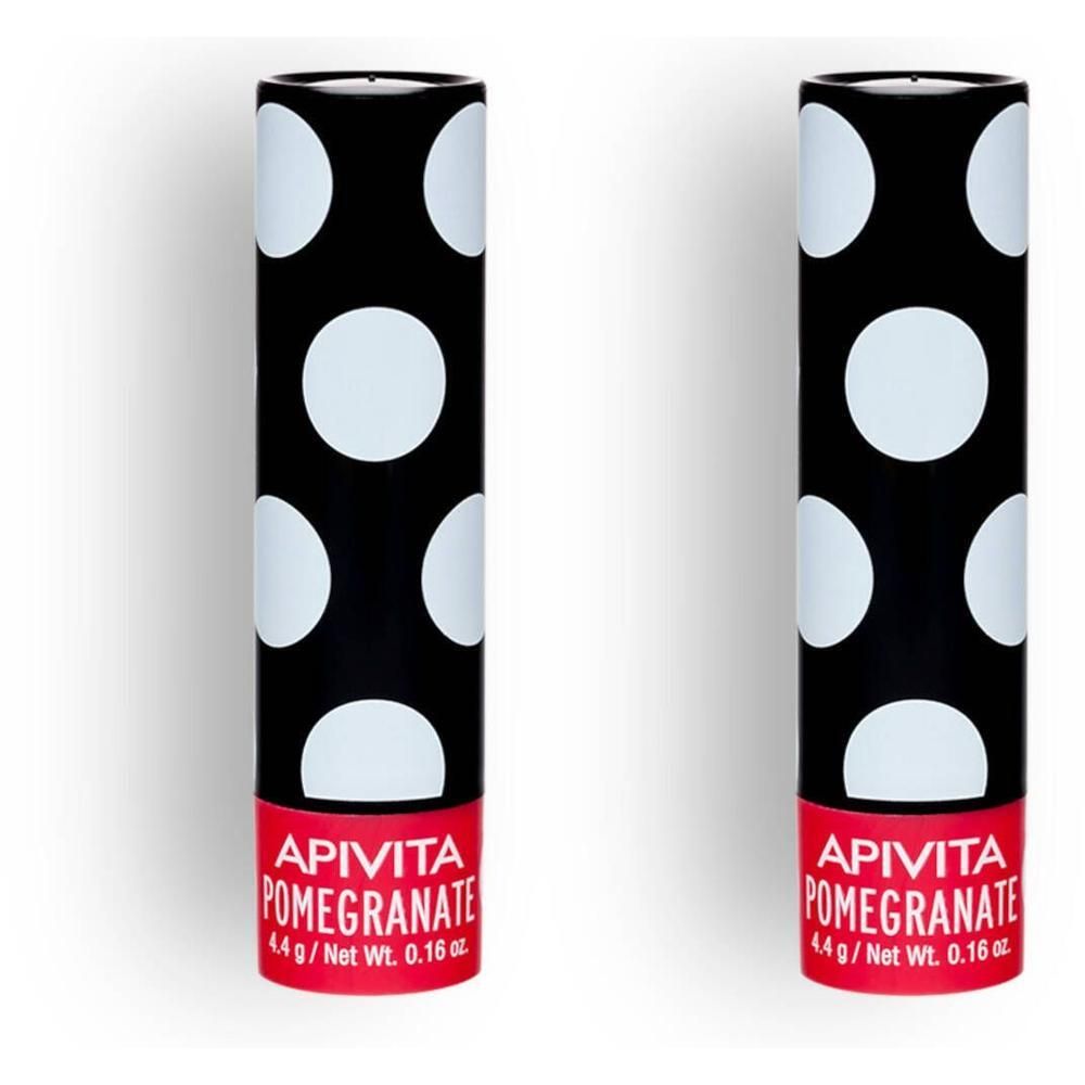 Twee Apivita granaatappel lippenbalsemsticks, zwarte huls met witte stippen.