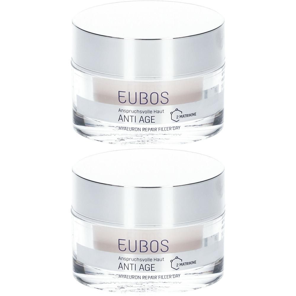 Twee Eubos Hyaluron Repair Filler Dag potjes met zilveren deksels. Helder glas toont de crème.
