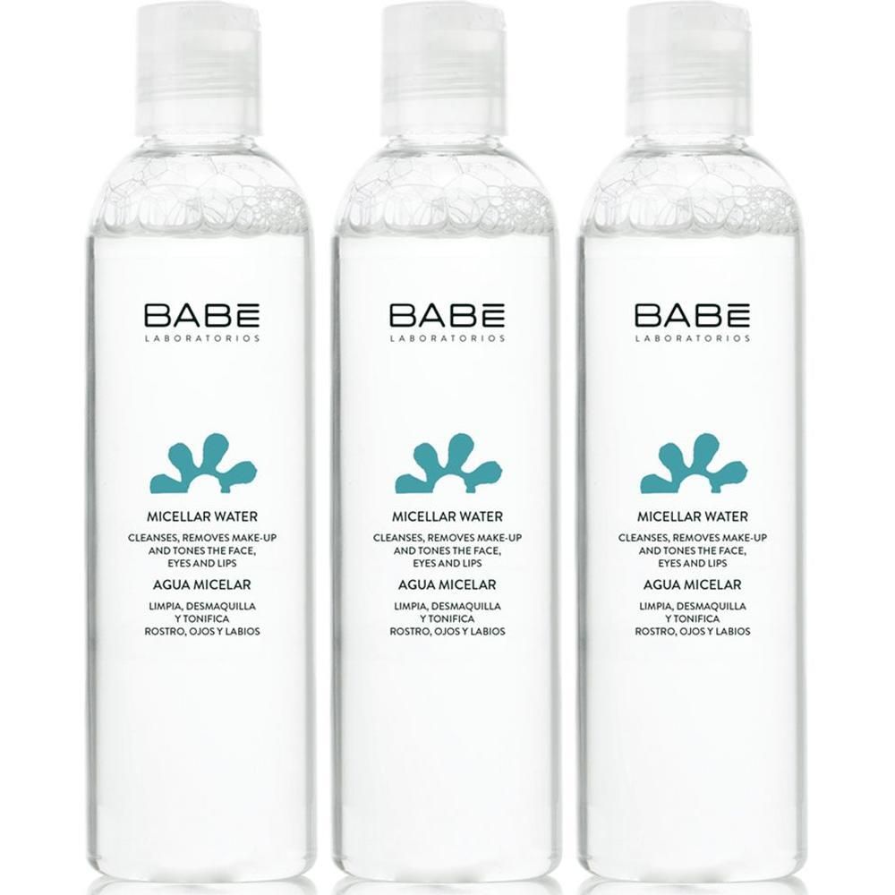 Trois bouteilles d'eau micellaire BABÉ avec étiquette claire et bouchon blanc.