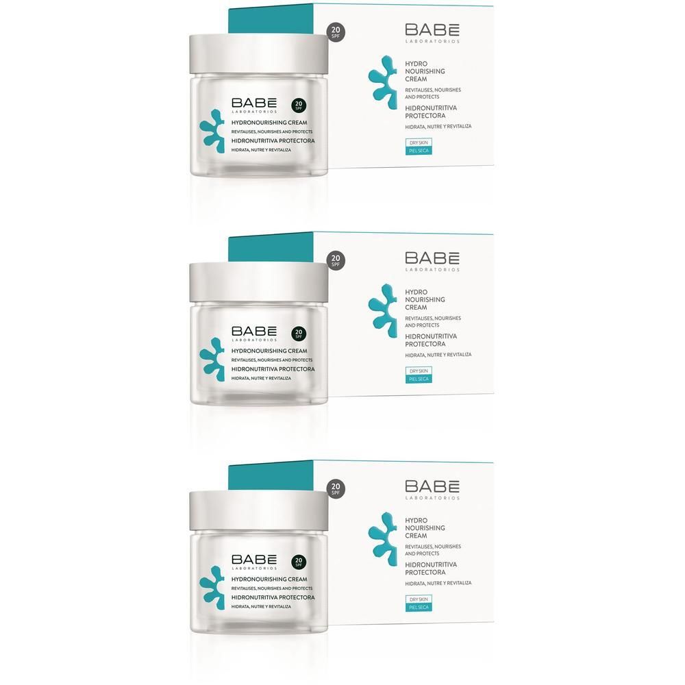 Drie potten BABÉ Hydro-Nutritive Crème SPF20 met verpakking. Heldere potten met witte dop en blauw logo.