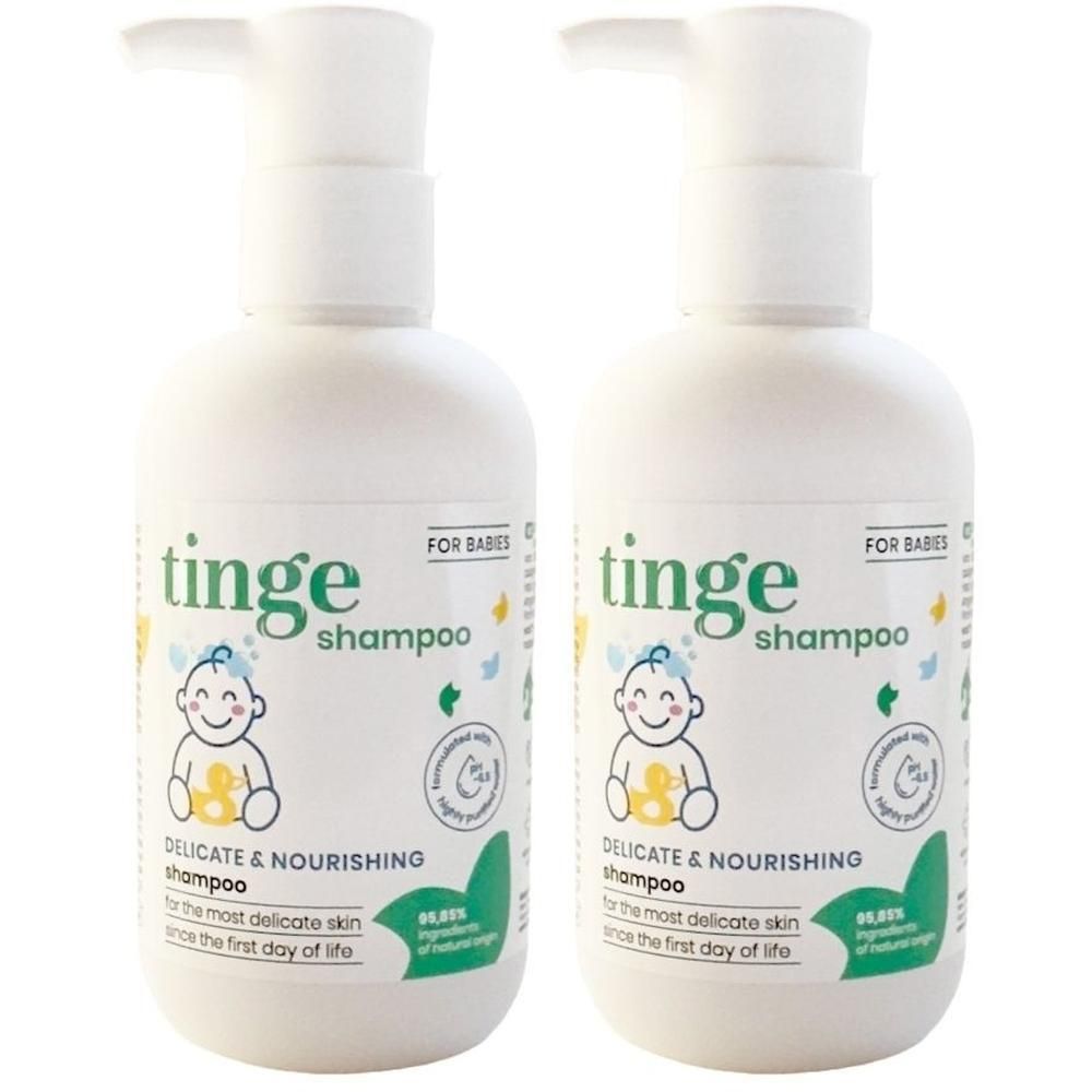 Deux flacons de shampooing Tinge pour bébés avec distributeurs à pompe.