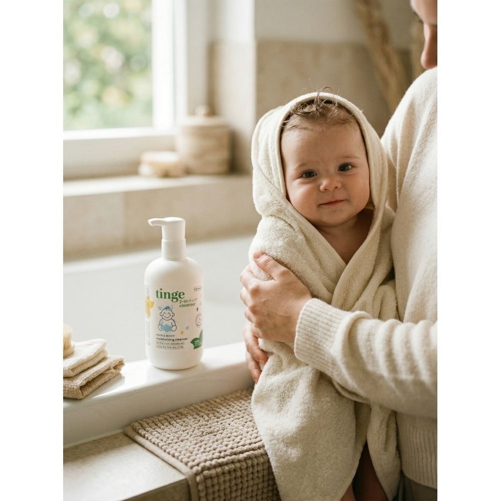 Tinge Gel Lavant 2-en-1 pour bébés avec informations détaillées sur le produit et icônes.