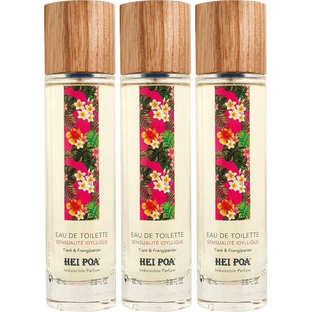 Trois flacons d'eau de toilette avec motif floral tropical et bouchon en bois.