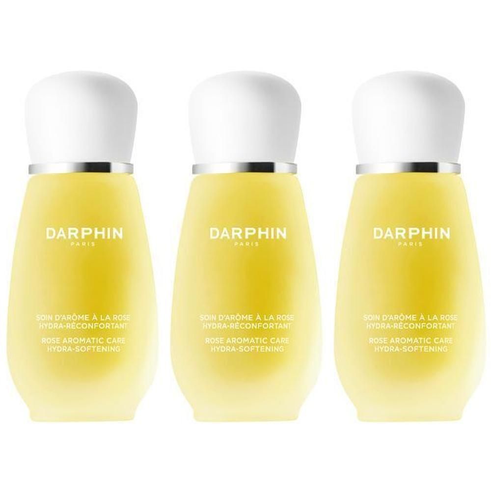 Trois flacons Darphin Elixir au contenu jaune et bouchons blancs.