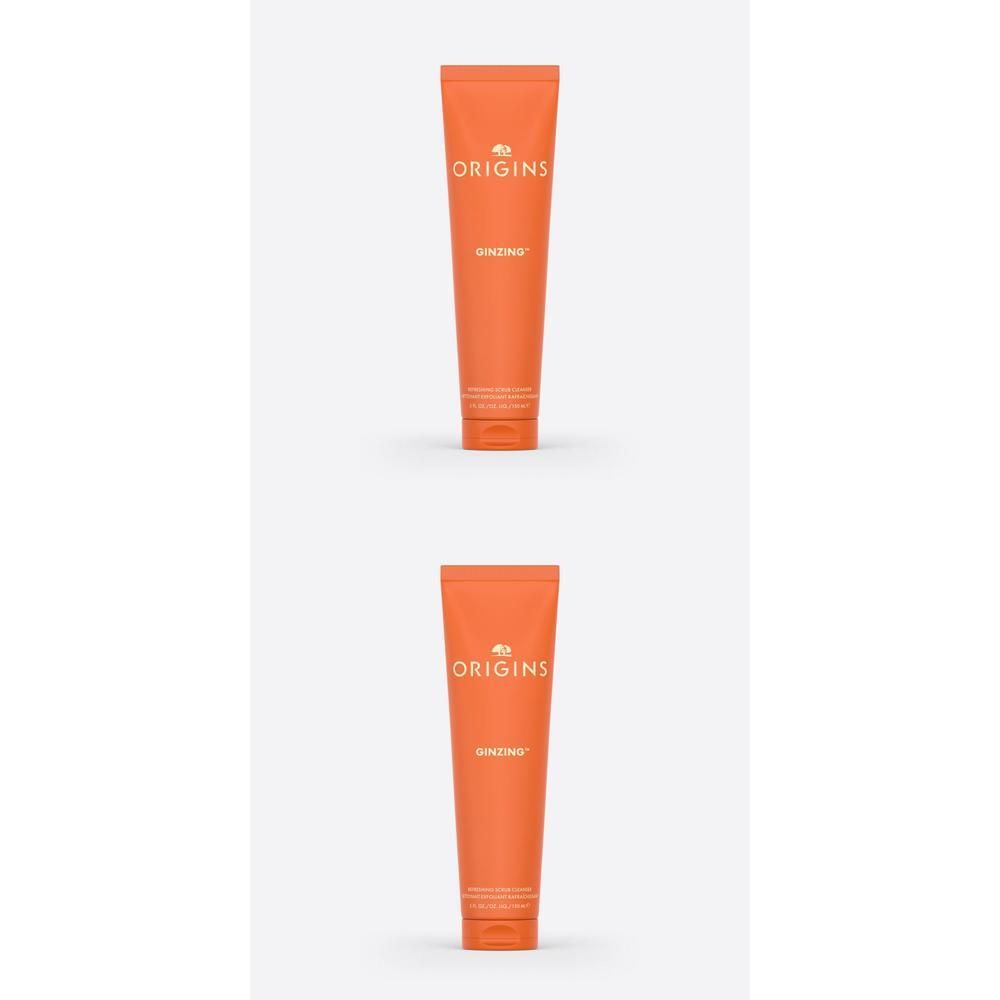 Twee oranje tubes met Origins GinZing opdruk.
