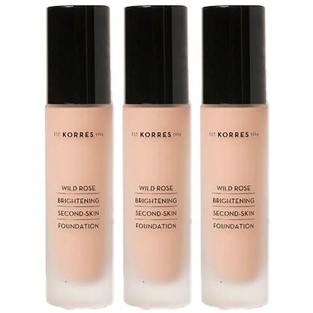 Drie flessen Korres Wild Rose Foundation met zwarte dop.