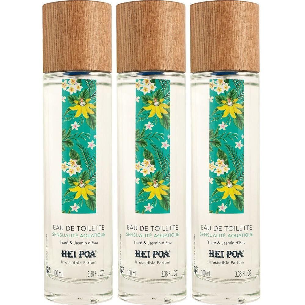 Trois flacons d'eau de toilette avec bouchons en bois et étiquette florale.