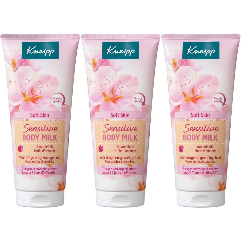 Trois tubes de Lait Corps Amandier Kneipp pour peaux sensibles, décorés de fleurs d'amandier.