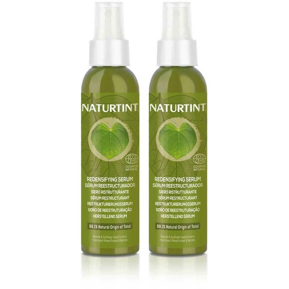 Twee groene Naturtint Herstellend Serum sprayflessen met bladvorm en bio-zegel.