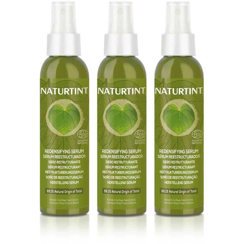 Drie groene spuitflessen Naturtint Redensifying Serum met bladmotief en zegels.