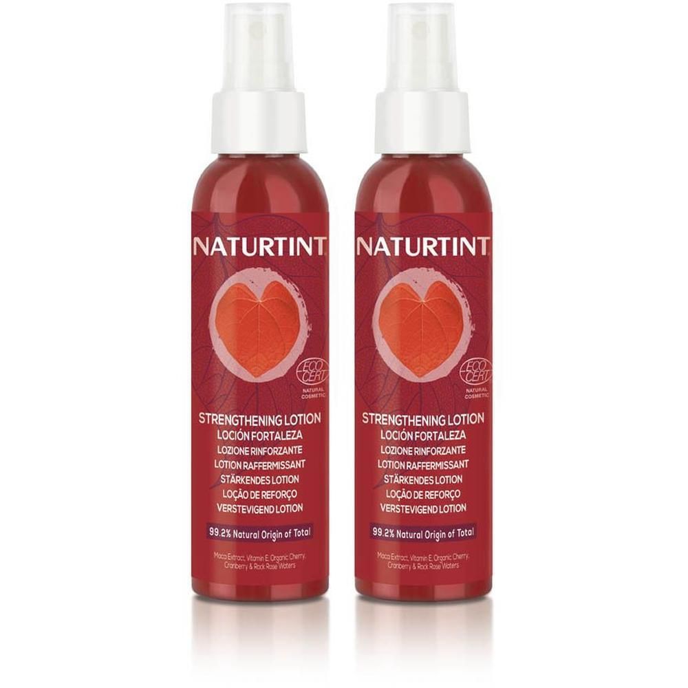 Twee flessen Naturtint Versterkende Lotion met rood etiket en hartsymbool. Spraykop boven.