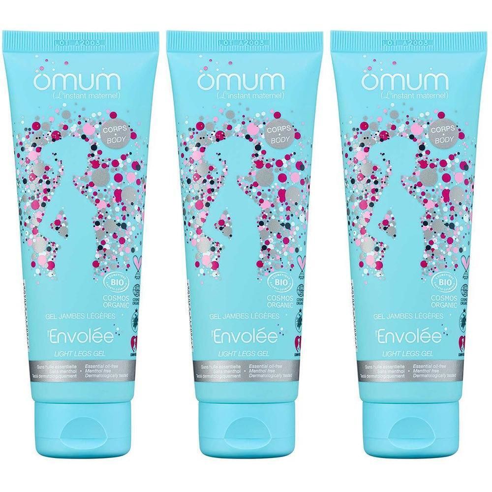 Drie lichtblauwe tubes van Omum L'Envolée Gel Jambes Légères, versierd met kleurrijke stippen.