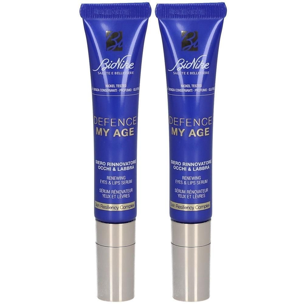 Twee BioNike Defence My Age oog- en lippenserums in blauwe tubes met zilveren doppen.