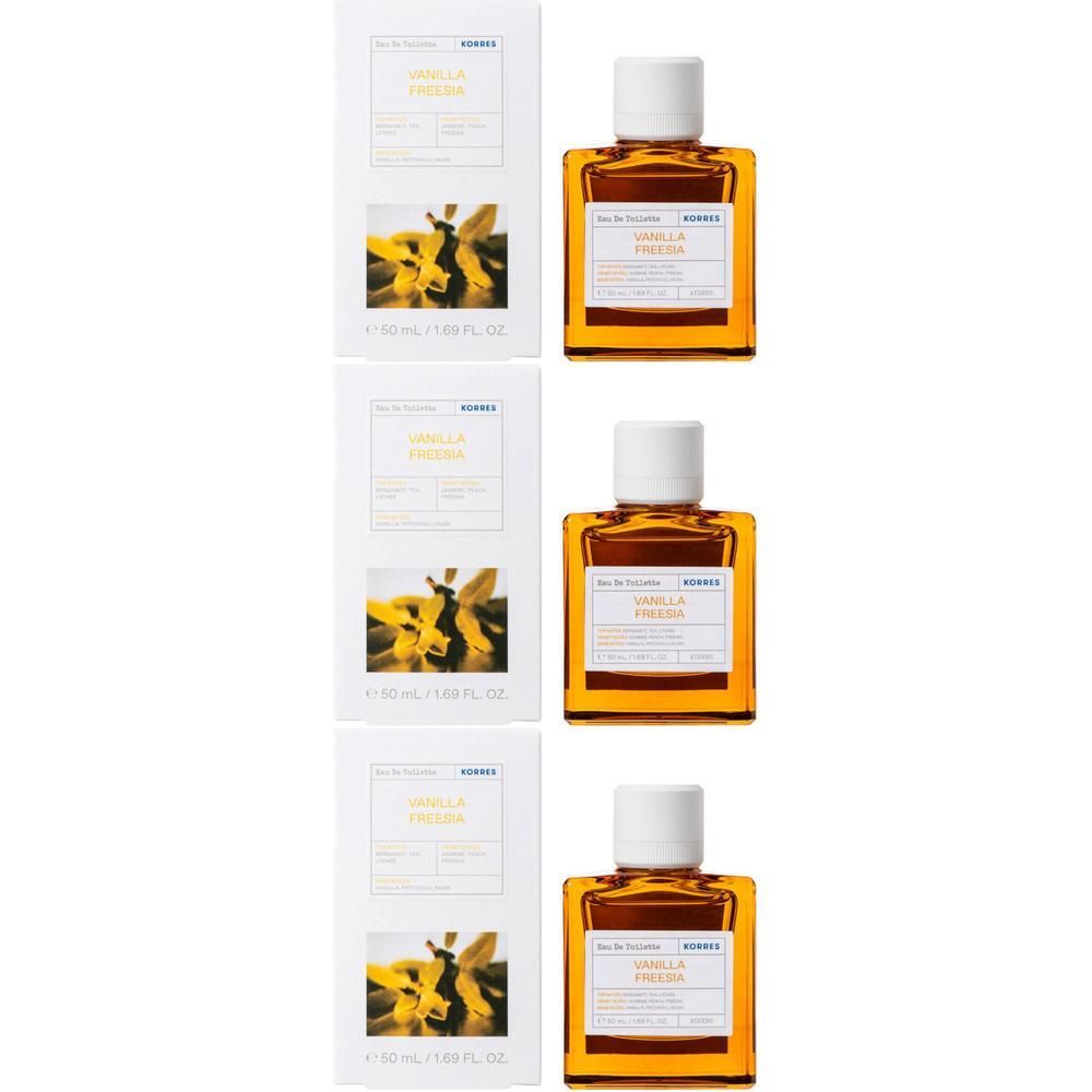 Drie flacons Eau de Toilette Vanilla Freesia van Korres met witte doppen en omdozen met bloemenafbeeldingen.