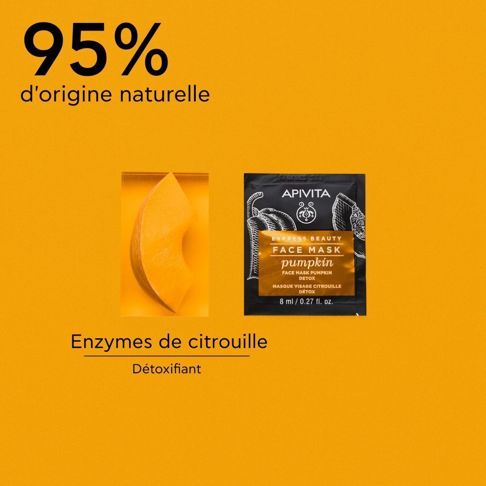 Masque facial Apivita Citrouille Detox et un morceau de citrouille.
