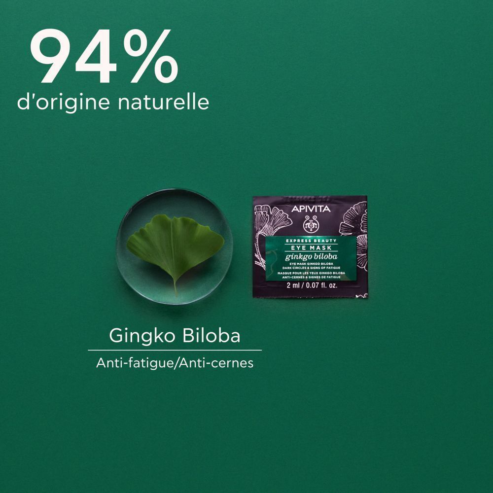 Feuille de Ginkgo Biloba à côté d'un sachet de Masque Yeux Apivita.